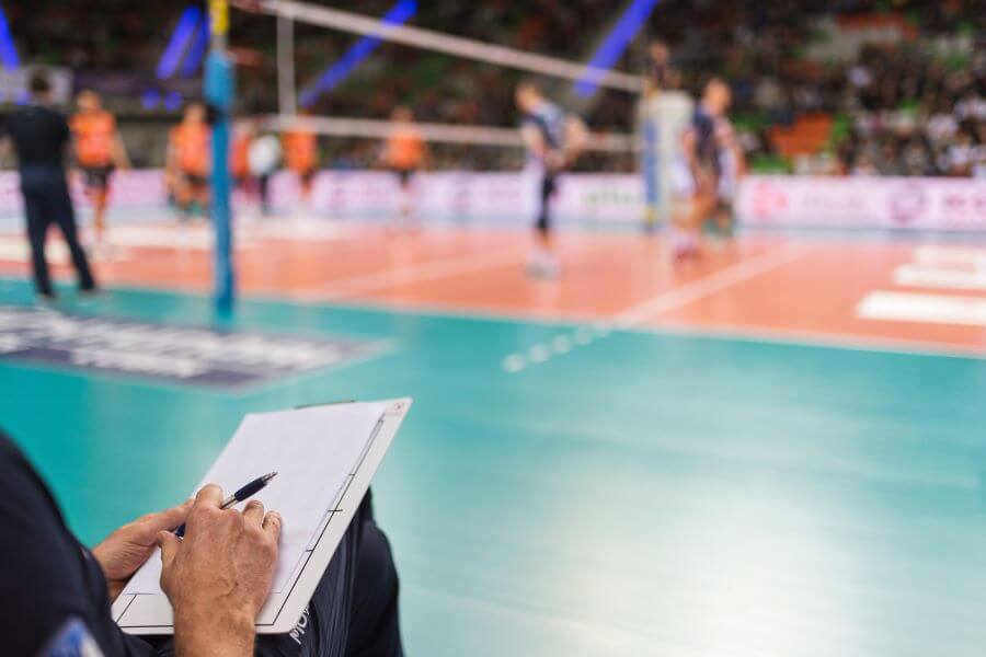 volleyball coach at sidelines