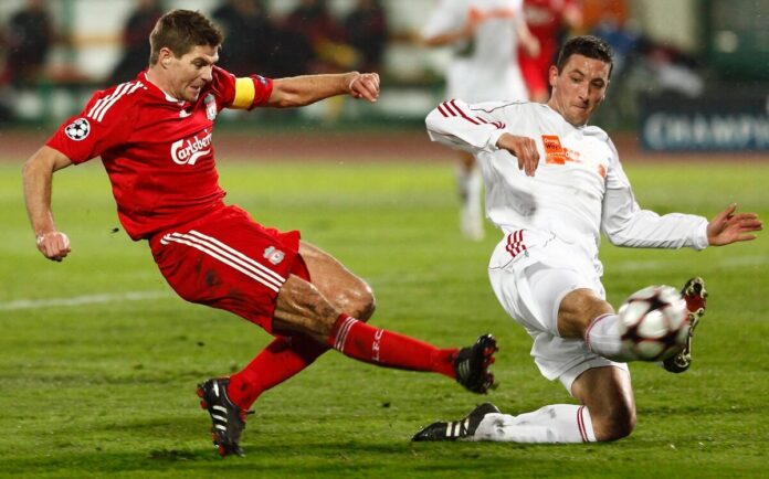 Steven Gerrard shooting for Liverpool against Debrecen Steven Gerrard shooting for Liverpool as a Debrecen defender attempts to block